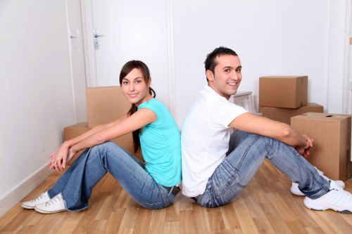 Local removal team handling boxes and furniture near central London flats