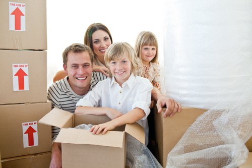 Office moving team coordinating equipment, boxes, and workspace setup in South London