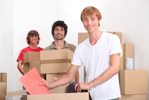 Careful packing of office equipment for a commercial move in South London