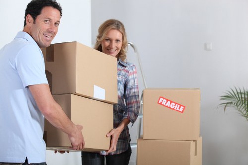 A business relocation scene showing office furniture being prepared for transport